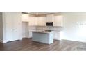 Spacious kitchen with stainless steel appliances, white cabinets, and gray countertops at 1062 Crest Mill Dr, Marietta, GA 30008