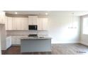 Bright open kitchen with granite countertops, stainless steel appliances, and a center island at 1062 Crest Mill Dr, Marietta, GA 30008