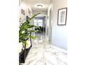 Elegant entryway featuring marble-look tile flooring, neutral paint, and decorative accents at 3179 Dunlin Lake Rd, Lawrenceville, GA 30044