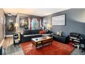 Stylish living room with a large couch, warm rug, and natural light, perfect for relaxation and entertaining at 385 Ralph Mcgill Ne Blvd # D, Atlanta, GA 30312