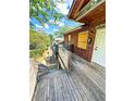 Exterior shot from the deck of the brick apartment building highlighting the wooden railing and steps at 208 Doane St, Atlanta, GA 30315