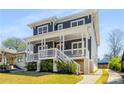 Beautiful two-story home featuring a covered front porch and a driveway at 431 Clifton Ne Rd, Atlanta, GA 30307