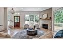 Inviting living room with a cozy fireplace and abundant natural light at 2175 James Aly, Atlanta, GA 30345
