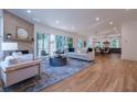 Spacious living room featuring hardwood floors, fireplace, and a seamless transition to an outdoor patio at 2175 James Aly, Atlanta, GA 30345