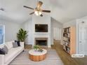 Bright living room with fireplace, vaulted ceilings, stylish furnishings, and streaming natural light at 2917 Yukon Nw Trl, Acworth, GA 30101