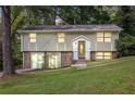 Inviting split-level home showcasing a well-kept lawn, traditional entrance, and plenty of natural light at 4690 Big Valley Ct, Stone Mountain, GA 30083