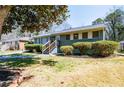 Single-story home featuring a recently painted exterior, an inviting entrance, and a well-maintained lawn at 264 Silver Springs Sw Cir, Atlanta, GA 30310