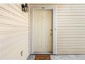 Front door to unit #1401 with paneled siding at 1401 Keys Crossing Ne Dr, Atlanta, GA 30319