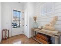 Bright foyer featuring wood floors, natural light, and an accent table at 557 Stone Field Nw Run, Marietta, GA 30060