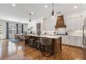 Open kitchen with a large island, modern lighting, and stainless steel appliances at 557 Stone Field Nw Run, Marietta, GA 30060