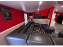 Spacious living room with a dark grey wrap around sofa at 615 Woodruff Rd, Carrollton, GA 30116