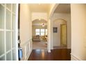 Welcoming entryway with hardwood floors and archways leading to the living spaces at 2409 Brynfield Cv, Suwanee, GA 30024