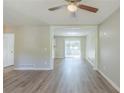 Bright living room with hardwood floors and a view into another room at 1477 Patricia Dr, Morrow, GA 30260