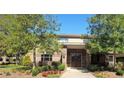 Attractive building with brick facade, complemented by lush landscaping, offering a welcoming entrance at 1800 Clairmont Lk # A719, Decatur, GA 30033