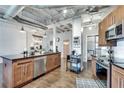 Modern kitchen features stainless steel appliances, granite countertops, and an open layout at 878 Peachtree Ne St # 535, Atlanta, GA 30309