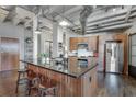 Well-designed kitchen with a large island, stainless steel appliances, and counter seating at 878 Peachtree Ne St # 535, Atlanta, GA 30309