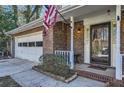 Inviting front porch with brick columns and a charming entrance at 4113 Stutz Ct, Tucker, GA 30084