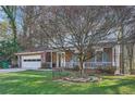 Beautiful two-story home with mature landscaping and a classic brick facade at 4113 Stutz Ct, Tucker, GA 30084