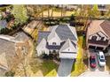 An aerial view of a home in a suburban neighborhood with mature trees and well-maintained lawns at 2698 Glenrose Hl, Atlanta, GA 30341