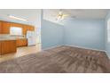 The Living room features neutral walls, ceiling fan and carpeted floor at 135 Tanyard Ct, Newborn, GA 30056