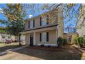 View of the two-story home, showcasing the landscaping and inviting entrance at 201 Coral Cir, Mcdonough, GA 30253