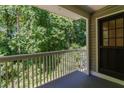 Inviting balcony featuring a white railing overlooking lush greenery, offering a peaceful outdoor space at 6379 Wedgeview Ct # 6379, Tucker, GA 30084
