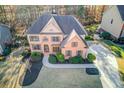 Beautiful brick home with mature trees in a quiet neighborhood and long driveway at 1674 Summersweet Ln, Dacula, GA 30019