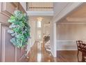 Bright foyer with hardwood floors and a view of the staircase at 1674 Summersweet Ln, Dacula, GA 30019