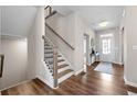 Inviting foyer with hardwood floors, staircase, and a view of the front door at 3534 Diplomat Aly, Scottdale, GA 30079