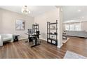 Bright office space featuring hardwood floors, modern decor, and a view of the living area at 3534 Diplomat Aly, Scottdale, GA 30079