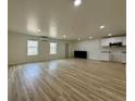Open floor plan living room featuring light wood flooring and recessed lighting, with modern AC unit at 3836 Saddle Hill Way, Douglasville, GA 30135