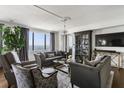 Comfortable living room with large windows offering great views, stylish decor, and abundant natural light at 75 14Th Ne St # 4150, Atlanta, GA 30309