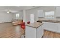 Bright, white kitchen with stainless steel appliances, granite countertops, and a breakfast bar at 1054 Mackets Ct, Atlanta, GA 30354