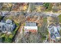 An aerial view of a beautiful home nestled among lush greenery and other homes in the neighborhood at 1305 Fairview Ne Rd, Atlanta, GA 30306