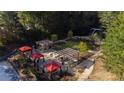Aerial view of community grilling and outdoor picnic area complete with charcoal grills and red canopy at 795 Hammond Dr # 407, Sandy Springs, GA 30328