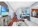 Cozy living space with hardwood floors, modern furniture, and a view into the well-equipped kitchen at 3324 Peachtree Ne Rd # 2807, Atlanta, GA 30326
