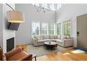 Bright living room with a vaulted ceiling, large windows, and comfortable seating at 155 Breakspear Ln, Fayetteville, GA 30214