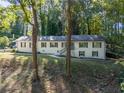 Well-maintained single-story home with a classic design and lush surroundings, creating a peaceful ambiance at 2418 Bolling Brook Sw Dr, Atlanta, GA 30311