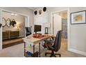 Bright and airy office space with an adjacent bathroom and view into a secondary living space at 345 Glen Iris Ne Dr # 5, Atlanta, GA 30312