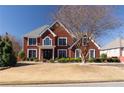 Beautiful two-story home with classic architectural details and a neatly maintained front yard at 5289 Browning Sw Way, Lilburn, GA 30047