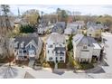 Aerial shot of a charming neighborhood featuring a well-maintained home with manicured lawns at 5930 Brundage Ln, Norcross, GA 30071