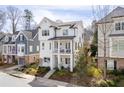 Beautiful two-story home with a white exterior, complemented by lush landscaping and a welcoming porch at 5930 Brundage Ln, Norcross, GA 30071
