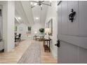 Welcoming foyer with light wood floors, vaulted ceilings, and an open view into the home at 6405 Cherry Tree Ln, Atlanta, GA 30328