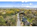 Scenic aerial view showcasing the neighborhood's lush greenery and city skyline at 1830 Marietta Nw Rd, Atlanta, GA 30318