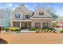 Inviting home with brick facade, covered porch, and professionally landscaped front yard at 1830 Marietta Nw Rd, Atlanta, GA 30318