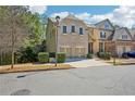 Attractive brick and siding home featuring an attached two-car garage and front yard greenery at 189 Privet Cir, Suwanee, GA 30024