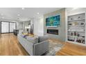 Open living room with modern fireplace, built-in shelves, and hardwood floors at 1926 Trotti Ne St, Atlanta, GA 30317