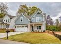 Beautiful two-story house with a manicured front lawn, two-car garage, and classic mailbox at 2955 Jefferson St, Austell, GA 30106