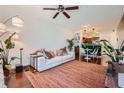 Bright living room with a large sectional sofa, open to the dining and kitchen areas at 390 17Th Nw St # 4031, Atlanta, GA 30363