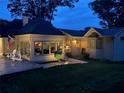 Backyard view of home with a sunroom, patio, and inviting outdoor seating with American flag at 584 Cherokee Ne St, Marietta, GA 30060